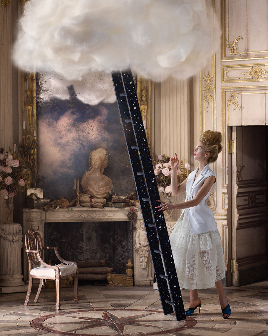 Elegant fashion model dressed in white stands in a Baroque interior (by Mulvany & Rogers), about to climb a ladder leading into a fluffy cloud at the top of the picture.