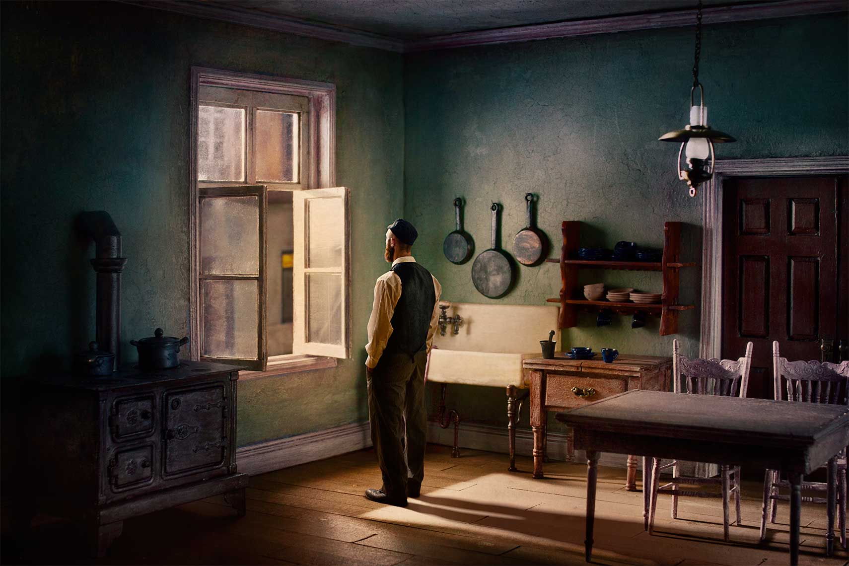 Painterly photomontage of 1930s Eastern European Jewish man standing in Hopper-like light in 1930s’ kitchen gazing out of the opened window.